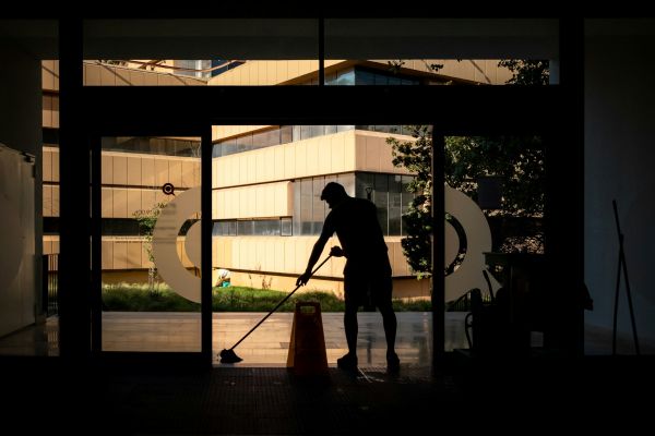 A facilities management contractor - cleaner - at work