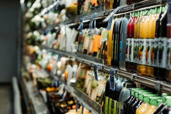 A shelf in a grocery shop representing the retail sector