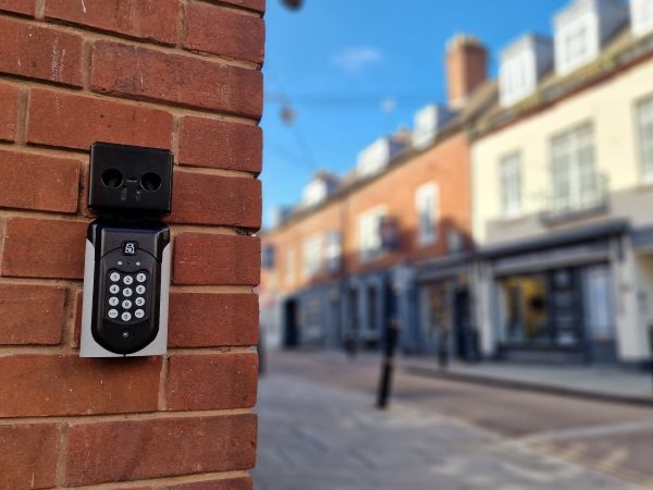 SentriGuard key safe installed on brick wall in town centre